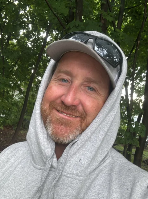 Jos Ha, treatment court graduate, smiling outdoors